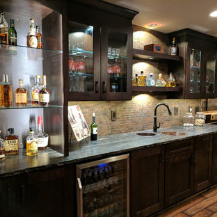 Photo of a large rustic fully buried basement in Other with grey walls, medium hardwood flooring, no fireplace and brown floors.