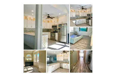 Beach style kitchen photo in Other with a farmhouse sink and quartz countertops