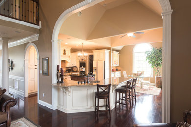 Inspiration for a timeless u-shaped eat-in kitchen remodel in Other with an island