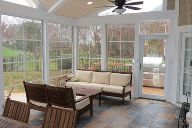 Photo of a mid-sized contemporary sunroom in Charlotte with concrete floors, a standard ceiling and no fireplace.