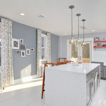 Open Modern Kitchen with Waterfall Edge Countertop