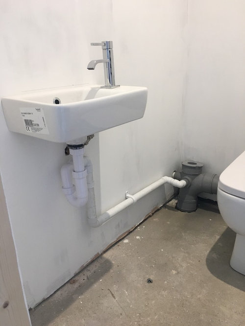 pipes behind toilet