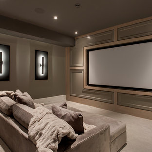 Home theater - large transitional enclosed carpeted and gray floor home theater idea in Calgary with gray walls and a projector screen