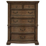 Magnussen - Magnussen Durango Drawer Chest in Willadeene Brown - Traditional by nature, the handsome Durango bedroom collection imparts fresh allure to a classically inspired design aesthetic. Rooted in old world styling, these timeless silhouettes feature intricate carvings, fluted pilasters and ornate scrollwork insets. Antique Brass hardware gives the room a warm metallic element while providing the perfect complement to Durango's gorgeous Willadeene Brown finish. If you're an admirer of traditional styling, this statement bed and coordinating storage pieces are a must-have.