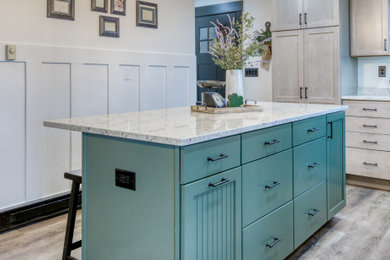 Inspiration for a mid-sized country u-shaped vinyl floor and multicolored floor open concept kitchen remodel in Baltimore with an undermount sink, beaded inset cabinets, green cabinets, granite countertops, white backsplash, granite backsplash, stainless steel appliances, an island and white countertops