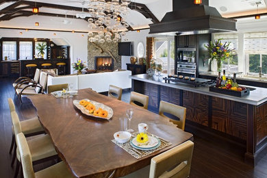 Inspiration for a large contemporary eat-in kitchen in Philadelphia with an integrated sink, flat-panel cabinets, dark wood cabinets, stainless steel benchtops, stainless steel appliances, dark hardwood floors and with island.