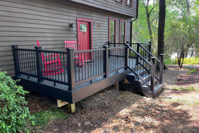 Inspiration for a small craftsman courtyard ground level mixed material railing deck remodel in Charlotte with a bbq area and no cover