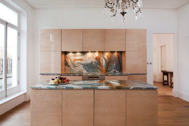 This is an example of a large contemporary kitchen in London.