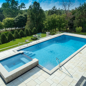 Burr Ridge Lap Pool with Raised Hot Tub and Waterfall