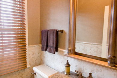 Example of a small classic bathroom design in Bridgeport with furniture-like cabinets, medium tone wood cabinets, a two-piece toilet, an undermount sink and granite countertops