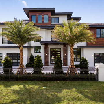 Front Elevation: Custom Impact Entry & Symmetrical Glazing