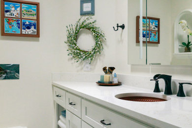 Small tuscan master blue tile and porcelain tile marble floor, gray floor and single-sink bathroom photo in Jacksonville with shaker cabinets, white cabinets, a wall-mount toilet, white walls, an undermount sink, quartz countertops, white countertops and a built-in vanity