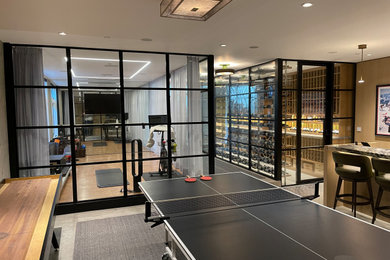Sleek Glass Wine Room with Walk-In Cellar and Metal Wine Racks