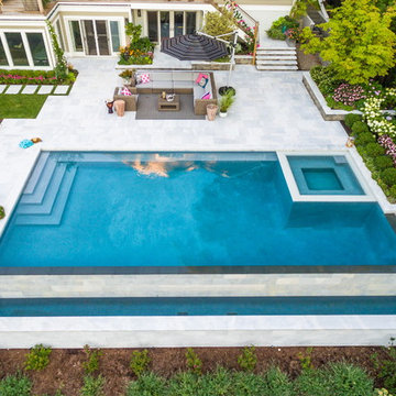 Luxury vanishing edge swimming pool and outdoor living area Ridgewood NJ