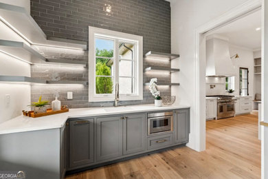 Inspiration for a transitional home bar remodel in Atlanta