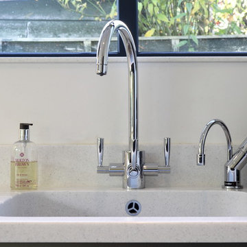 Kitchen tap alongside a instant hot water tap