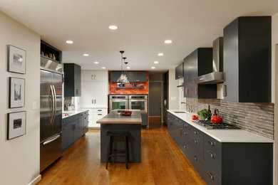 Eat-in kitchen - large contemporary u-shaped light wood floor eat-in kitchen idea in DC Metro with an undermount sink, flat-panel cabinets, gray cabinets, granite countertops, gray backsplash, stone slab backsplash, stainless steel appliances and an island