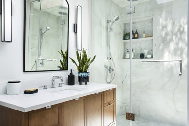 Mid-sized midcentury master bathroom in Toronto with shaker cabinets, medium wood cabinets, a double shower, white tile, porcelain tile, white walls, porcelain floors, an undermount sink, engineered quartz benchtops, black floor, a shower curtain, white benchtops, a niche, a single vanity and a freestanding vanity.