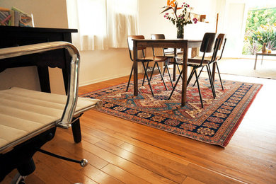 Mid-sized 1950s light wood floor kitchen/dining room combo photo in Los Angeles with white walls