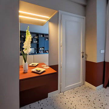 Oasi colorata: soggiorno e cucina tra Blu, Verde e Arancio