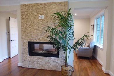 Mid-sized transitional formal and open concept medium tone wood floor and brown floor living room photo in DC Metro with beige walls, a ribbon fireplace, a tile fireplace and no tv