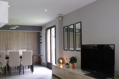 This is an example of a large contemporary living room in Other with grey walls, ceramic floors and grey floor.