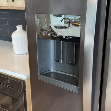 Angled Kitchen Design with Slab Style Cabinets in Pecan Stain