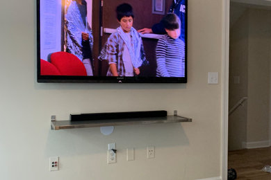 Large elegant open concept family room photo in Atlanta with a wall-mounted tv