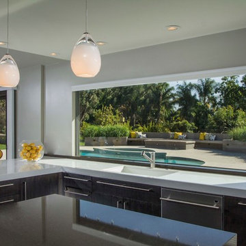 Kitchen window overlooking the pool