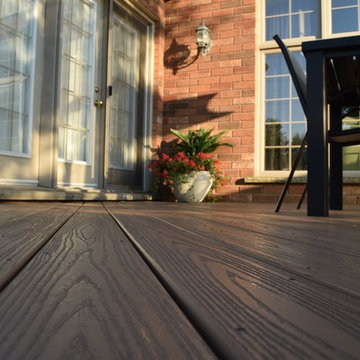 This custom Hickory Dickory Decks shows curves are in with low maintenance Veka.
