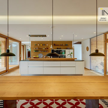 Kitchen in crisp white and mellow wood.