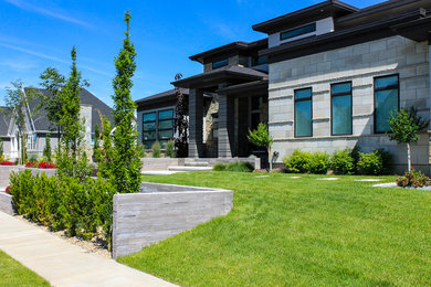 Inspiration for a mid-sized modern gray one-story stone exterior home remodel in Salt Lake City