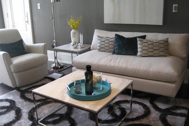 Example of a mid-sized trendy open concept and formal dark wood floor and brown floor living room design in Toronto with gray walls, no fireplace and no tv