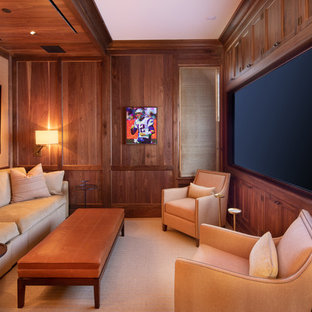 Home theater - transitional enclosed home theater idea in DC Metro with brown walls and a media wall
