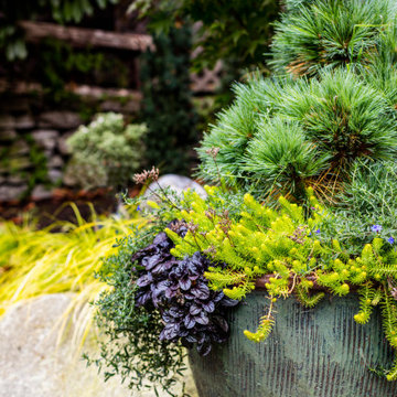 A Cozy Garden for Outdoor Living Amongst Stone and Greenery