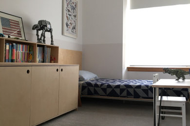 Photo of a small modern bedroom in Wiltshire with white walls, carpet, no fireplace and grey floors.