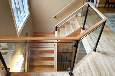 Example of a minimalist wooden l-shaped wood railing staircase design in New York with wooden risers