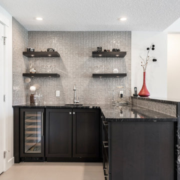 Modern Basement Bar With Textured Tile & Black Stone Countertop