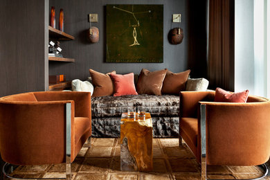 Photo of a modern living room in Atlanta with brown walls, dark hardwood floors, no fireplace and brown floor.