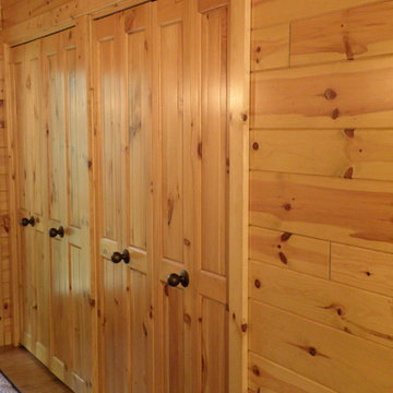 Bi-fold closet doors made with knotty pine paneling