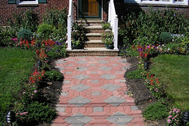 Photo of a mid-sized traditional drought-tolerant front yard brick walkway in Philadelphia.