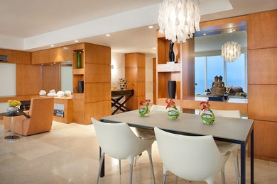 This is an example of a large contemporary open plan dining in Miami with white walls and marble floors.
