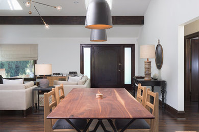 Transitional kitchen/dining combo in Los Angeles with dark hardwood floors and brown floor.
