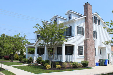 Mid-sized traditional white three-story concrete fiberboard exterior home idea in Philadelphia with a shingle roof