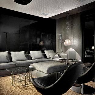 Inspiration for a contemporary home theater remodel in Chicago with black walls and a projector screen