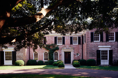 Huge traditional two-story brick gable roof idea in New York