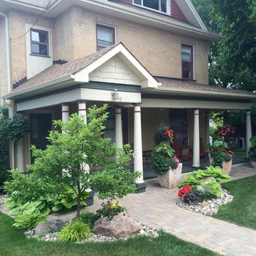 Lakefield, river rock garden and pavers entrance