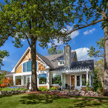 Craftsman nestled into the trees with outcropping boulders