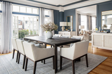 Inspiration for a transitional medium tone wood floor and brown floor dining room remodel in Sacramento with blue walls