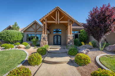 Example of a mountain style double front door design in Other with a metal front door
